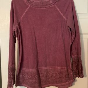 Washed out maroon top, nice detailing on the bottom of sleeves and shirt itself.